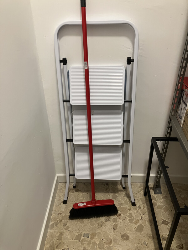 Broom, ladder and small table